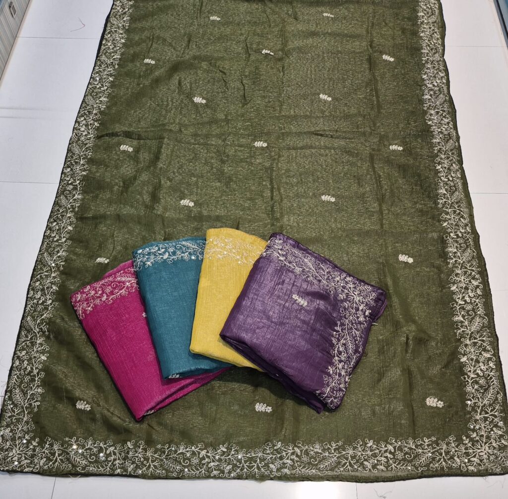 Beautiful embroidered saree collection in pink, teal blue, yellow, and purple colors, displayed on an olive green base saree. Each saree features delicate white floral thread embroidery with an elegant border design. Ideal for festive wear sarees, party wear sarees, wedding sarees, and traditional occasions.